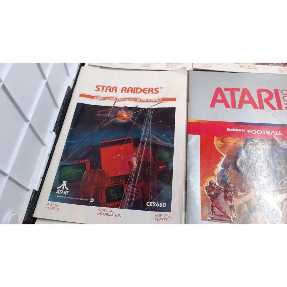 Lot of 7 Atari 2600 Games with Manuals Star Raiders Pac-Man Yars Revenge NTSC